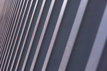 Obraz premium Modern Fence Topping with Sharp, Diagonal Black Slats