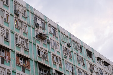 High-Density Residential Building Facade with Pastel Green Trim