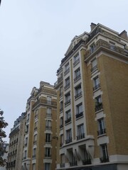 Paris, November 2025 : Visit of the magnificent city of Paris, Capital of France - View on different facades of buildings built by Baron Haussmann
