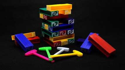 Colorful uno stacko blocks on black background