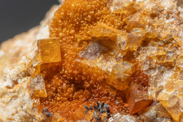 Beautiful mineral formation with blue and orange crystals discovered in natural stone
