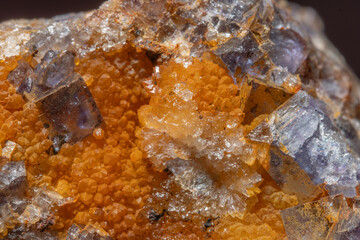 Beautiful mineral formation with blue and orange crystals discovered in natural stone