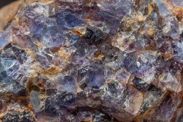 Quartz and fluorite crystal formation with bright reflections on geological rock