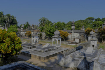 historic tombs of the mir jafar dynasty with old stone structures, greenery and ornate walls in murshidabad
