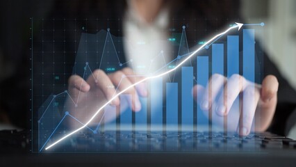 Business professional engages in financial analysis, using technology to assess data trends. Effective tools for strategic planning and informed investment decision-making. Copula