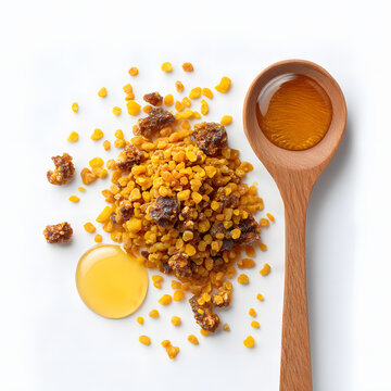 Bee pollen and propolis granules with honey in wooden spoon, isolated on white background, natural superfood and apitherapy product
