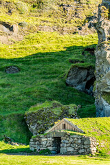 A stone shelter nestles into the hillside under Southern Iceland&rsquo;s afternoon sky where tradition and nature quietly converge