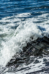 Midday waves clash with basalt bones along the rugged edge of Black Beach in Southern Iceland&rsquo;s volcanic embrace