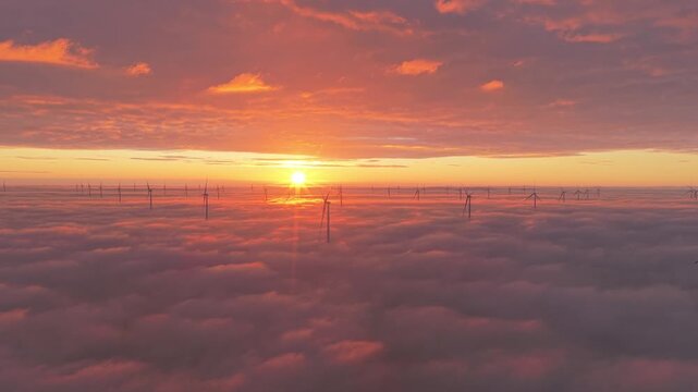 Aerial view of wind turbines above the clouds, Netherlands.