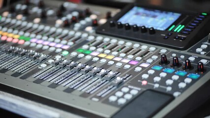 Professional digital audio mixer controlling sound levels for live music and events - Powered by Adobe