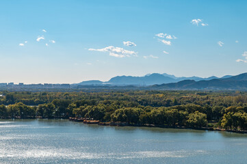The natural scenery of Kunming Lake and distant mountains in Beijing
