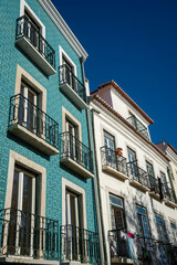 View of a typical facades or a row of historic tiled buildings in Lisbon, Portugal