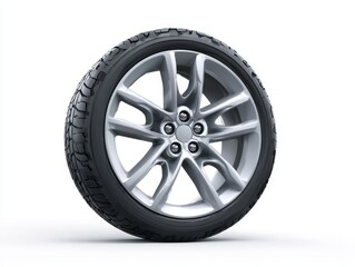 Fototapeta premium A silver alloy wheel with a smooth finish and intricate design stands against a stark white background, highlighting its details and stylish elements