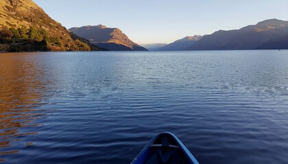 Scenic nature landscape view of a blue mountain lake in the morning with clouds and sky