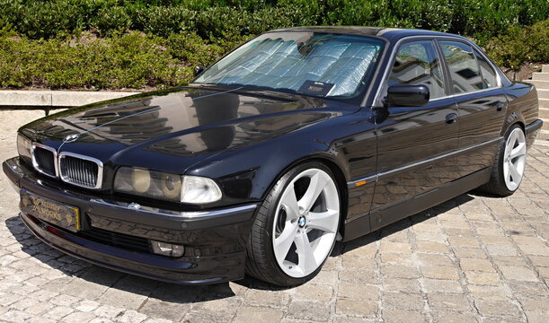 BMW 7 Series E38 black luxury sedan parked outdoors