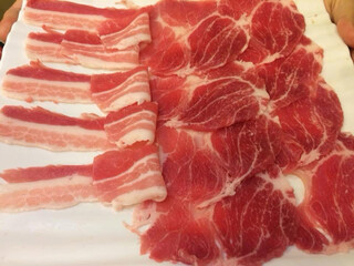 a plate of Shabu shabu sliced meat; beef and pork. Japanese traditional meal; Sukiyaki main ingredient. Japan restaurant product