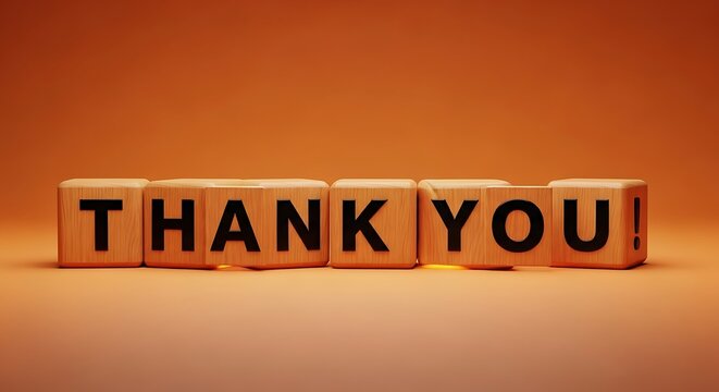 Wooden blocks spelling out the words thank you against a warm orange background, conveying appreciation and gratitude