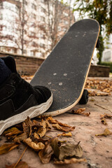 skateboard and shoe in a park in autumn © Jimmy