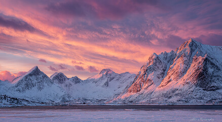 Snow-capped mountain range under vibrant aurora borealis at dusk; natural landscape concept.