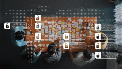 A team collaborates in a modern office, using sticky notes to brainstorm while data security elements are illustrated with locks and binary code overlay. Raster