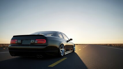 Sleek black sports car driving on highway at sunset