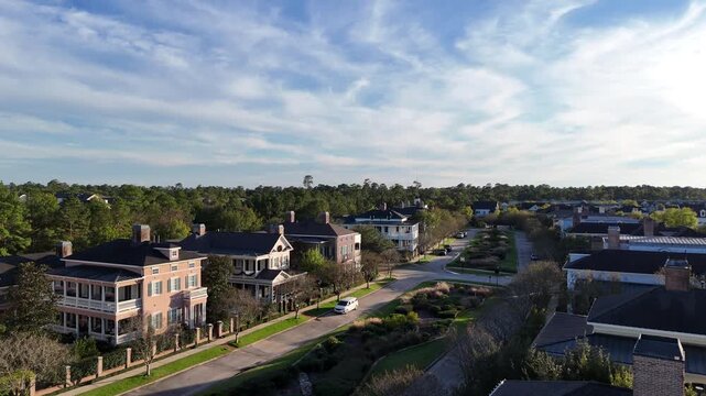 Large mansion houses with swimming pool, in affluent neighborhood metroplex, expensive suburban homes surrounding by lush green trees, aerial view, Texas, USA
