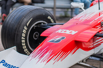 Obraz premium Formula 1 Toyota TF-108 car at a race track, predominantly red and white with sponsor logos Kaspersky, Panasonic, Pirelli racing slicks, aerodynamic design, coolin - Kyiv, Ukraine 10-10-2024