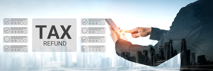 A businessman analyzes tax refund information on a tablet against an urban backdrop, showcasing the intersection of finance and technology during tax season. Gantry