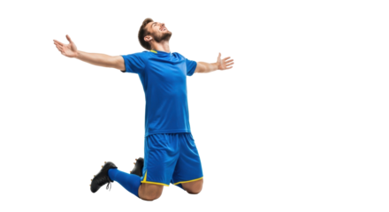 Young muscular male athlete in pristine royal blue uniform, kneeling, arms outstretched in pure jubilation with a soccer ball, against a transparent studio background. Concept of triumph