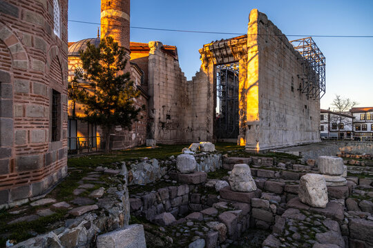 The Temple of Augustus in Ankara, a Roman monument from the ancient city of Ancyra, stands against a blue sky. This historical site neighbors Haci Bayram Mosque in the park. Turkey, Anatolia.

