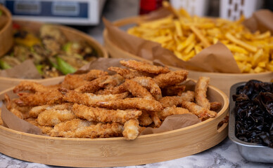Crispy fries with seasoned chicken, savory chicken strips served with crispy golden fries and olives