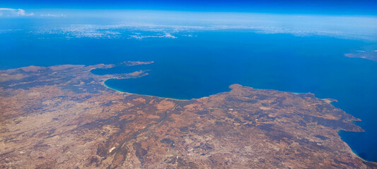 View from plane of coast and Mediterranean islands 