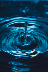 328.Vertical Splash and Ripples on Blue-Tinted Water