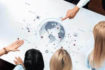 A team of professionals collaborates over a modern table, analyzing global data visualizations and exploring trends in artificial intelligence and technology. Trope