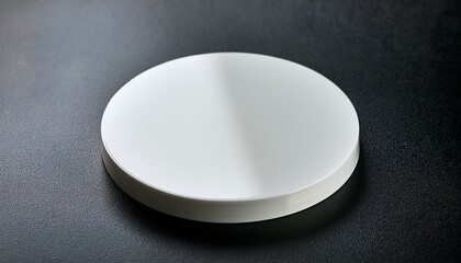 White Round Coaster On Dark Surface