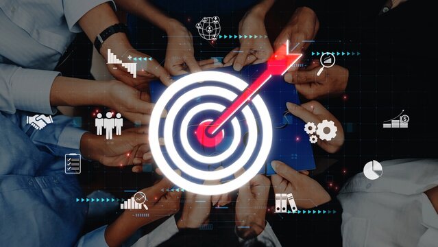 A group of diverse individuals collaboratively reaching for a central target symbol, surrounded by digital icons representing business strategies and performance metrics. Raster