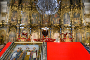  Two crowns, a cup of wine and a cross prepared for baptism