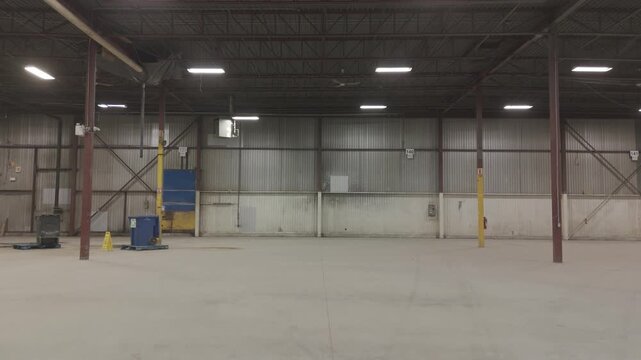 Drone flying through an empty warehouse ready to be stocked