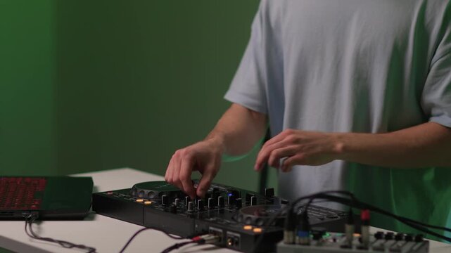 DJ setup overview, Energetic club DJ performing with digital controller in action, Content creator mixing music live using digital turntables under vibrant stage lights