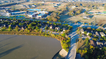 Commercial district with multi-building layouts, parking lots, decorative fountain park sit...