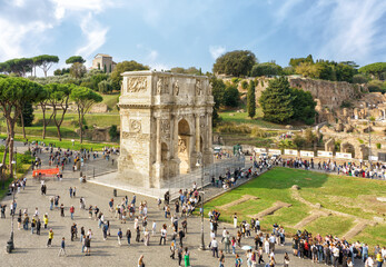Rome, Italy, Arch of Constantine. Historic arch stands majestically in a bustling square filled...