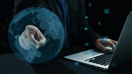 Engaging visual of a user interacting with a digital globe on a laptop, representing modern communication technologies and global connectivity in business. Cipher