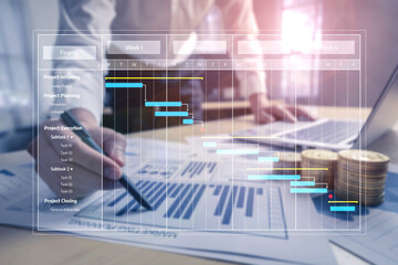 Detailed view of a business project management process showcasing a Gantt chart, financial data, and coins, emphasizing organization and strategic planning in the workplace. Tessel
