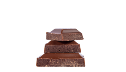 Stack of three dark chocolate squares, each with a slightly different size, on a white background, studio shot. alpha channel