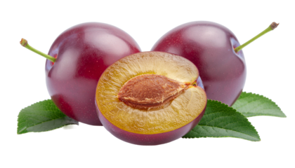 Two whole plums and a halved plum with a pit, accompanied by green leaves, are presented in a close-up view. isolated on white