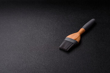 Brush, silicone kitchen utensils for cooking and baking at home. Silicone brush