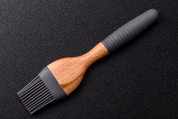 Brush, silicone kitchen utensils for cooking and baking at home. Silicone brush