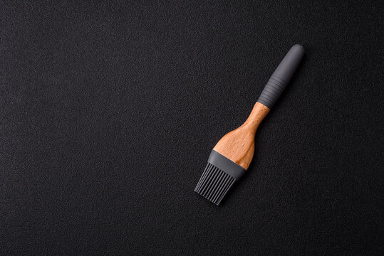 Brush, silicone kitchen utensils for cooking and baking at home. Silicone brush