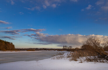 Snowy landscape with a blue sky and a few clouds