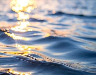 Gleaming sunlit ocean waves, the light reflecting and shimmering in the water in an array of blue and gold tones